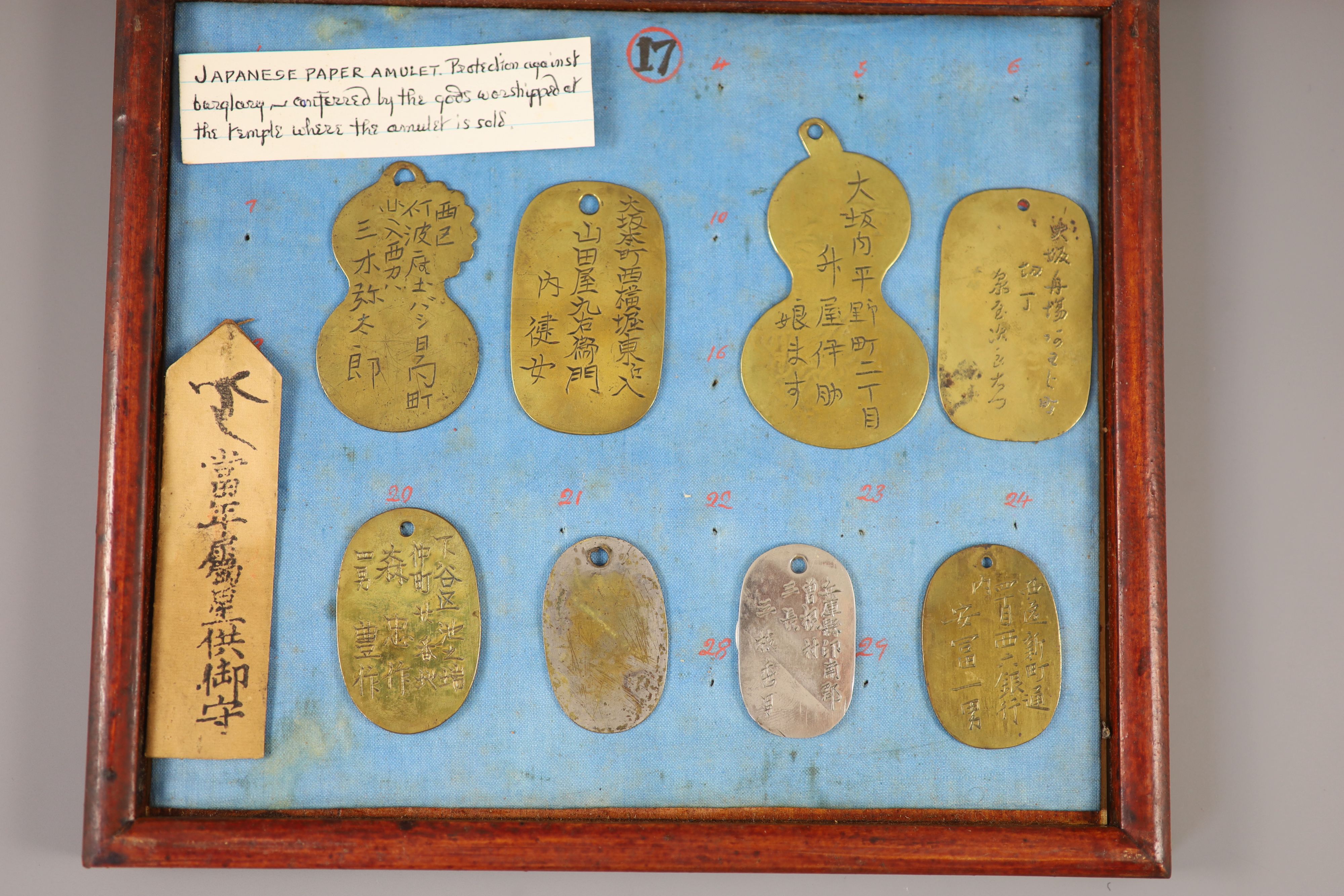 A group of 40 Japanese bronze and metal amulets or charms, 19th/20th century,